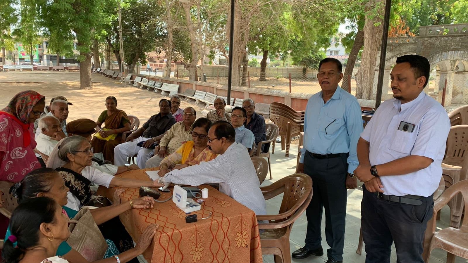 Organisers addressing those gathered at the health check-up camp held in the church grounds.